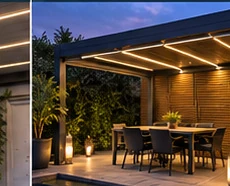 Pergola mit eingeschalteter LED-Beleuchtung über einem Sitzbereich